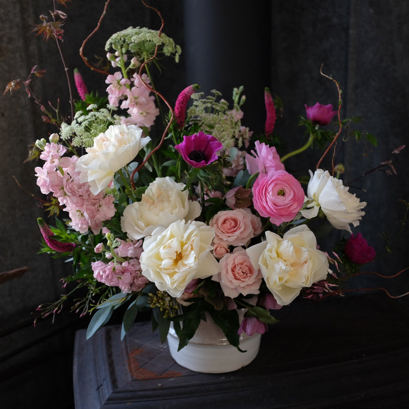 Atwood Flower Bouquet with Maple Branches, Hellebore, and Garden Roses by Michler's Florist