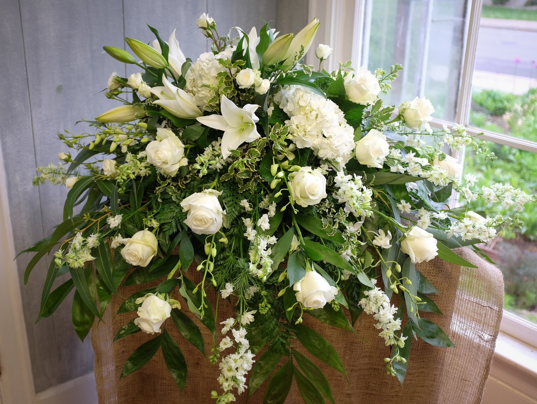 Galaxy Wide Blue and White Funeral Flowers Spray